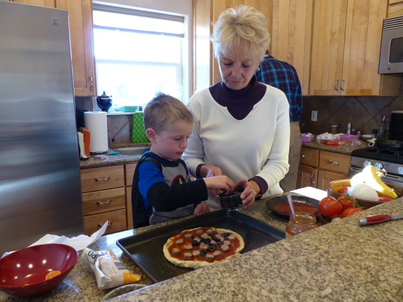 Grammy and Quinn make a Quinn-friendly pizza.